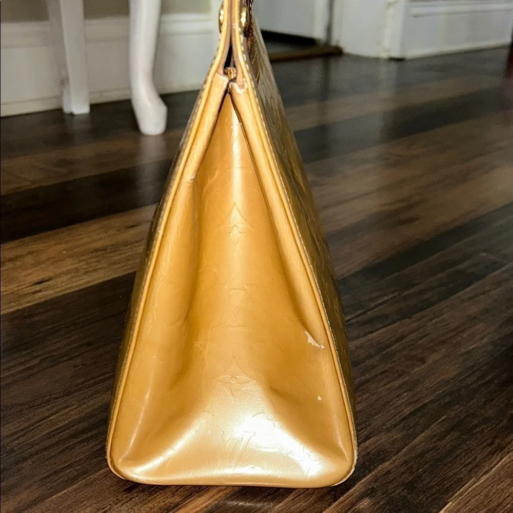 LOUIS VUITTON Gold Tote with Iconic Embossed Design
